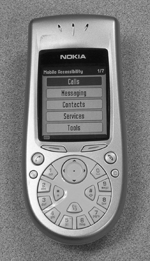 Figure 1: Photo of the Nokia 3650. The screen menu lists Calls, Messaging, Contacts, Services, and Tools.